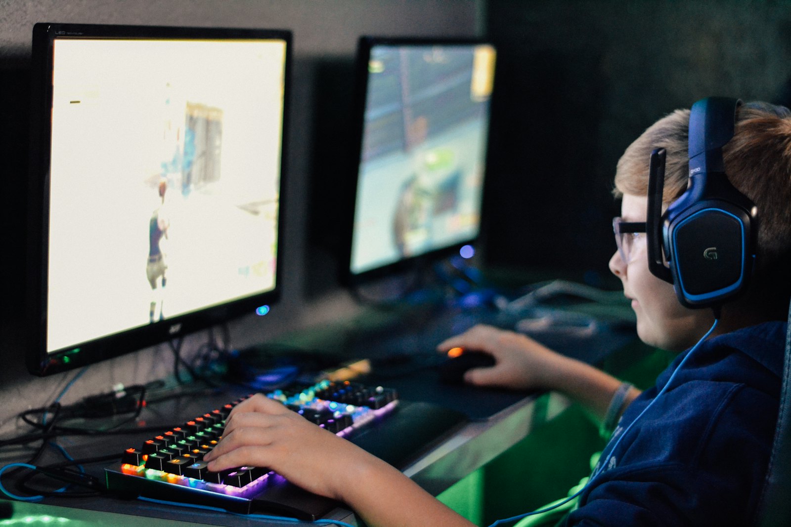 A teenager gaming with a headset on